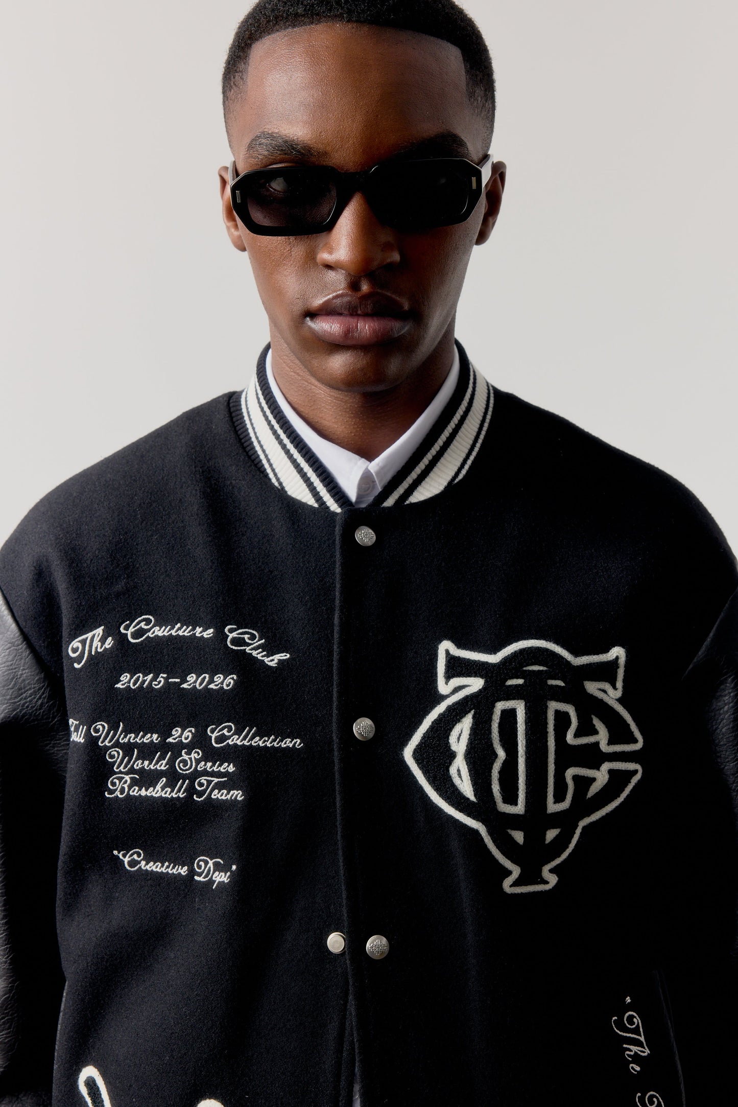MULTI BADGE VARSITY JACKET - BLACK