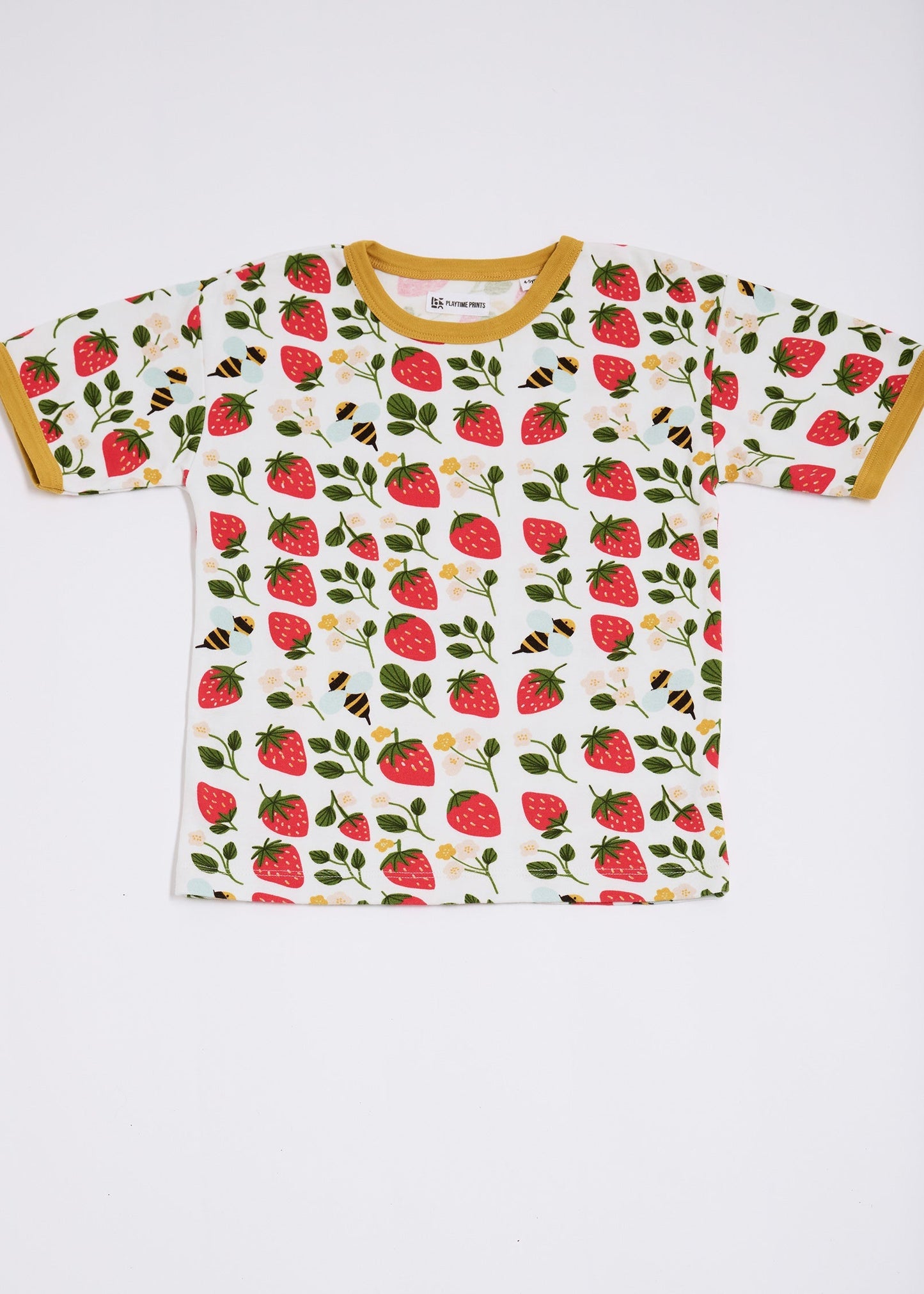 Front of short sleeved t-shirt featuring an all over strawberry and bees print with contrast honey neck and sleeve trim.