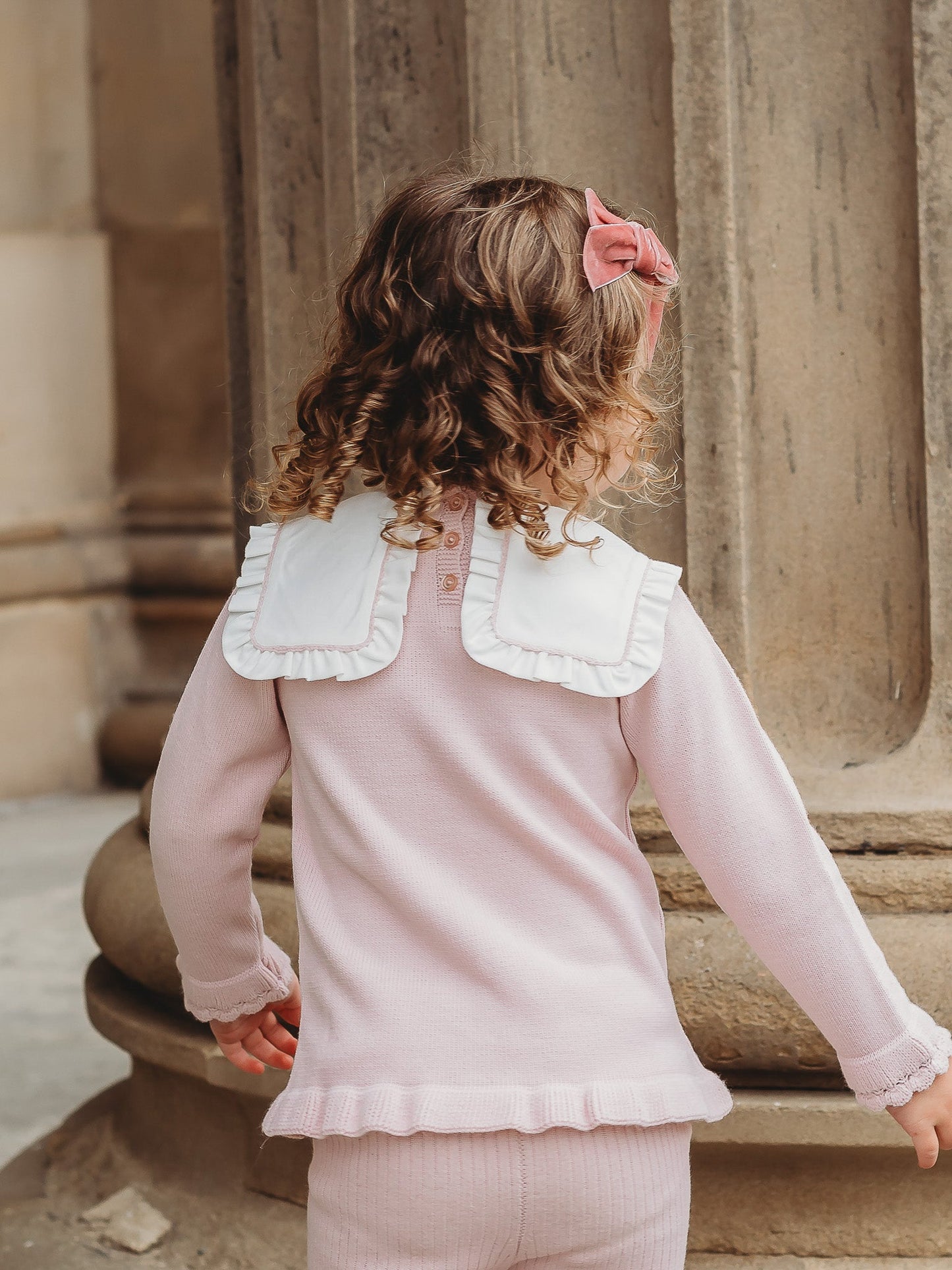 'Etta' pink knitted suit with bib collar - Rose & Albert