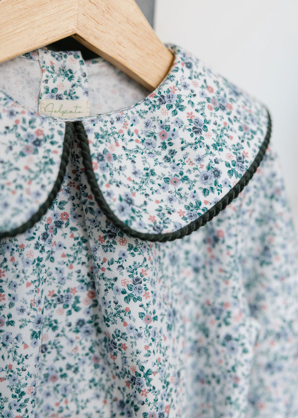 Floral dress with a collar on a hanger