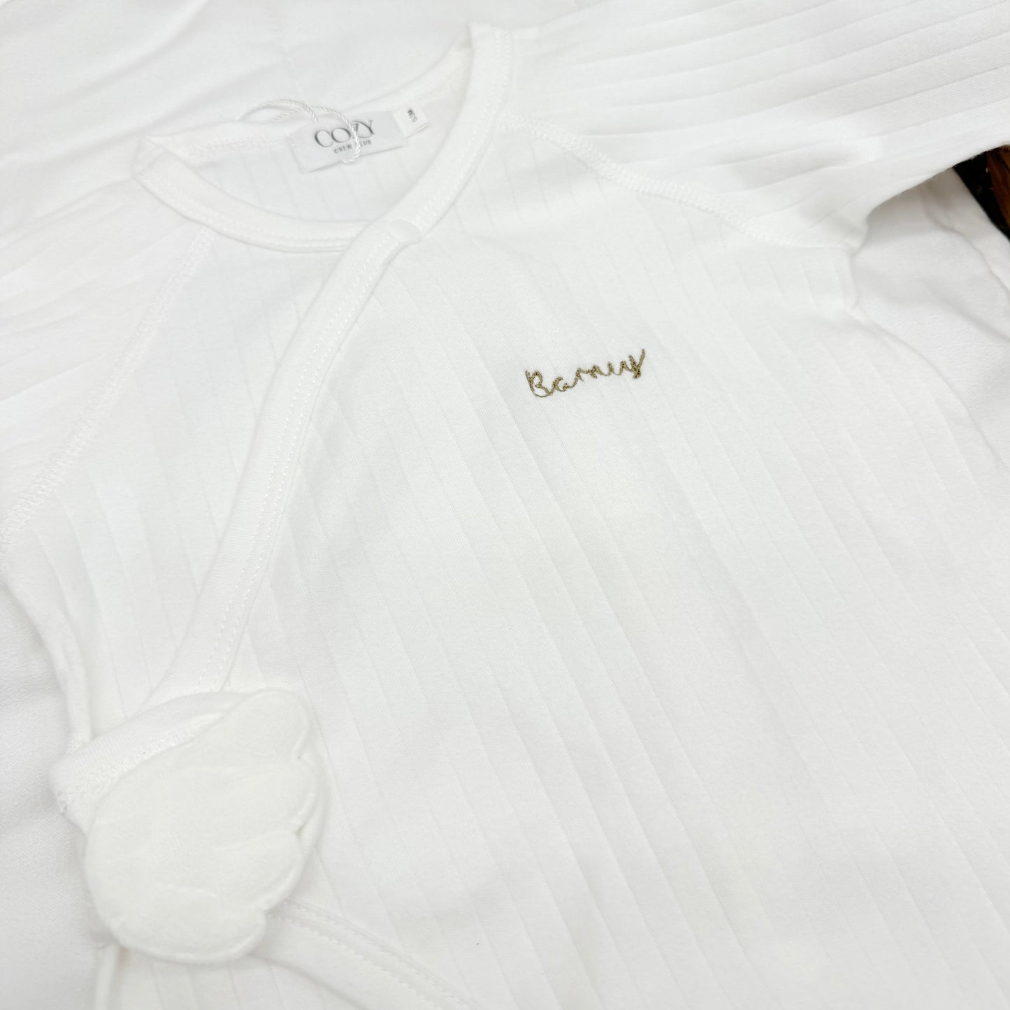 The Angel Boucle Wrap Baby Grow Romper in White