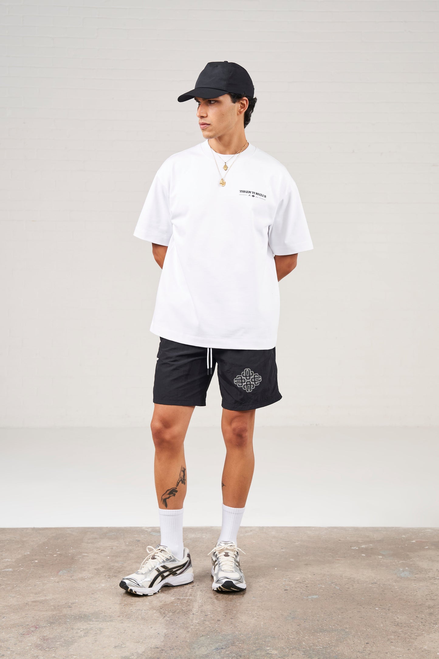 COPYRIGHT EMBLEM MID LENGTH SWIM SHORTS - BLACK