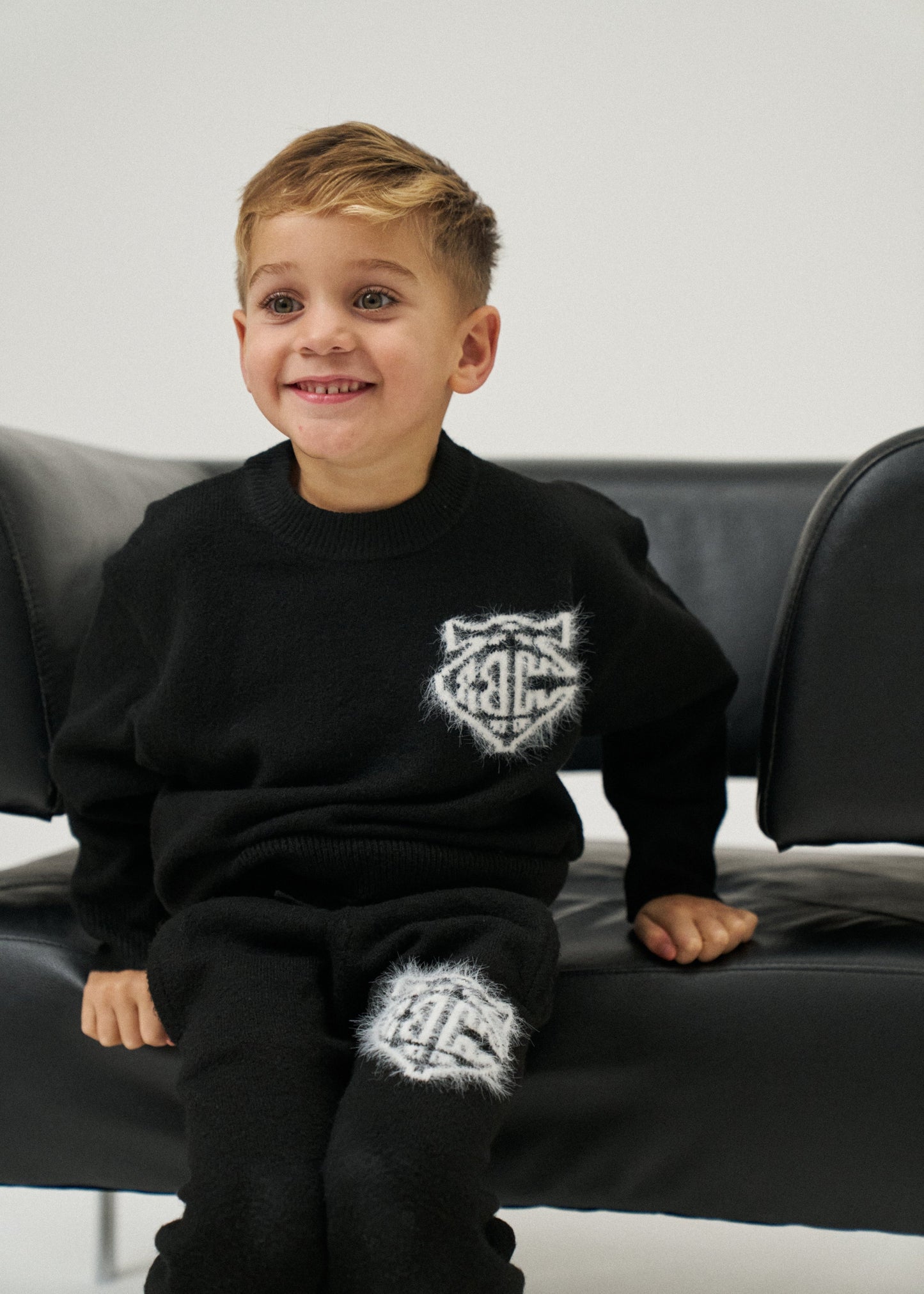 Kids Monogram Emblem Fluffy Knit Joggers in Black