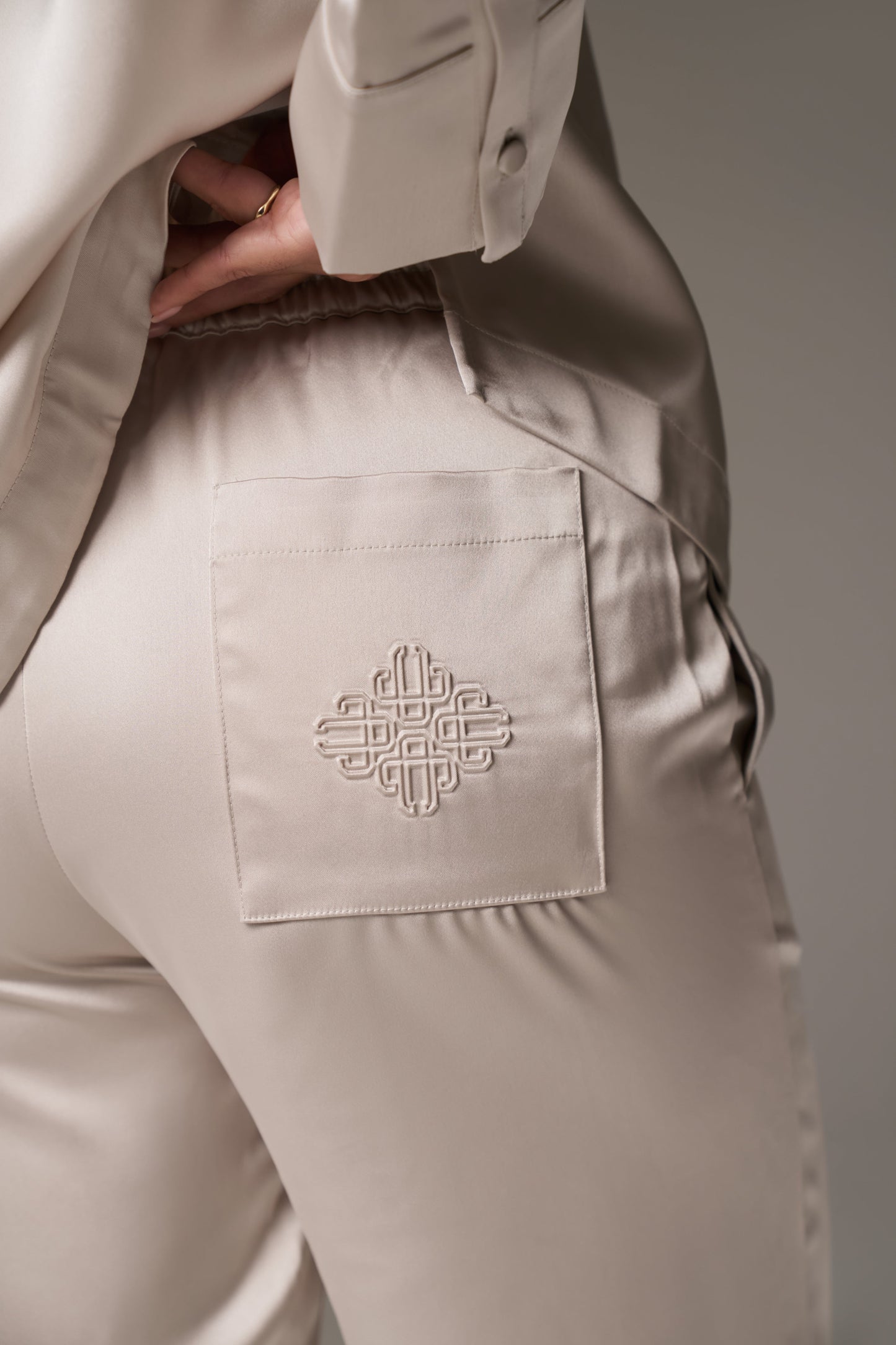 SATIN EMBLEM TROUSERS - BEIGE