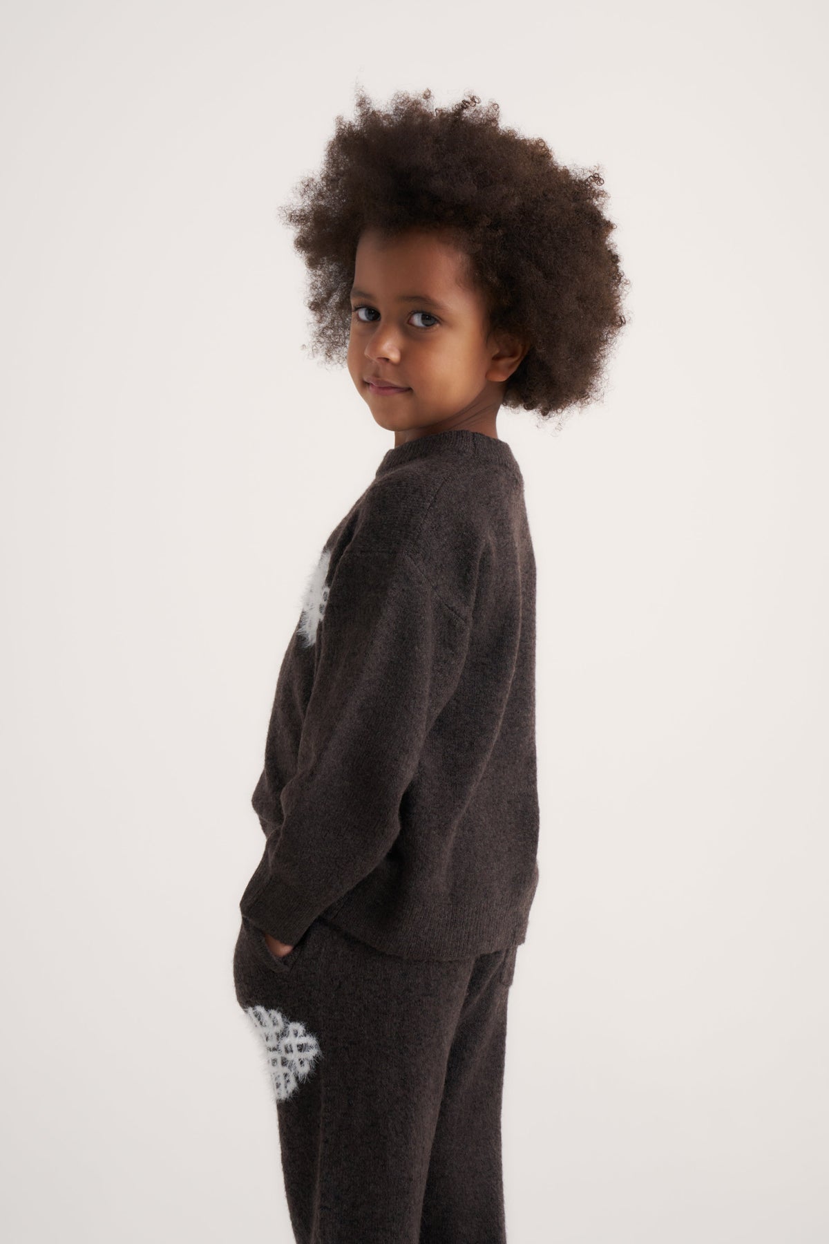 Kids Emblem Fluffy Knit Crew in Brown – model side view