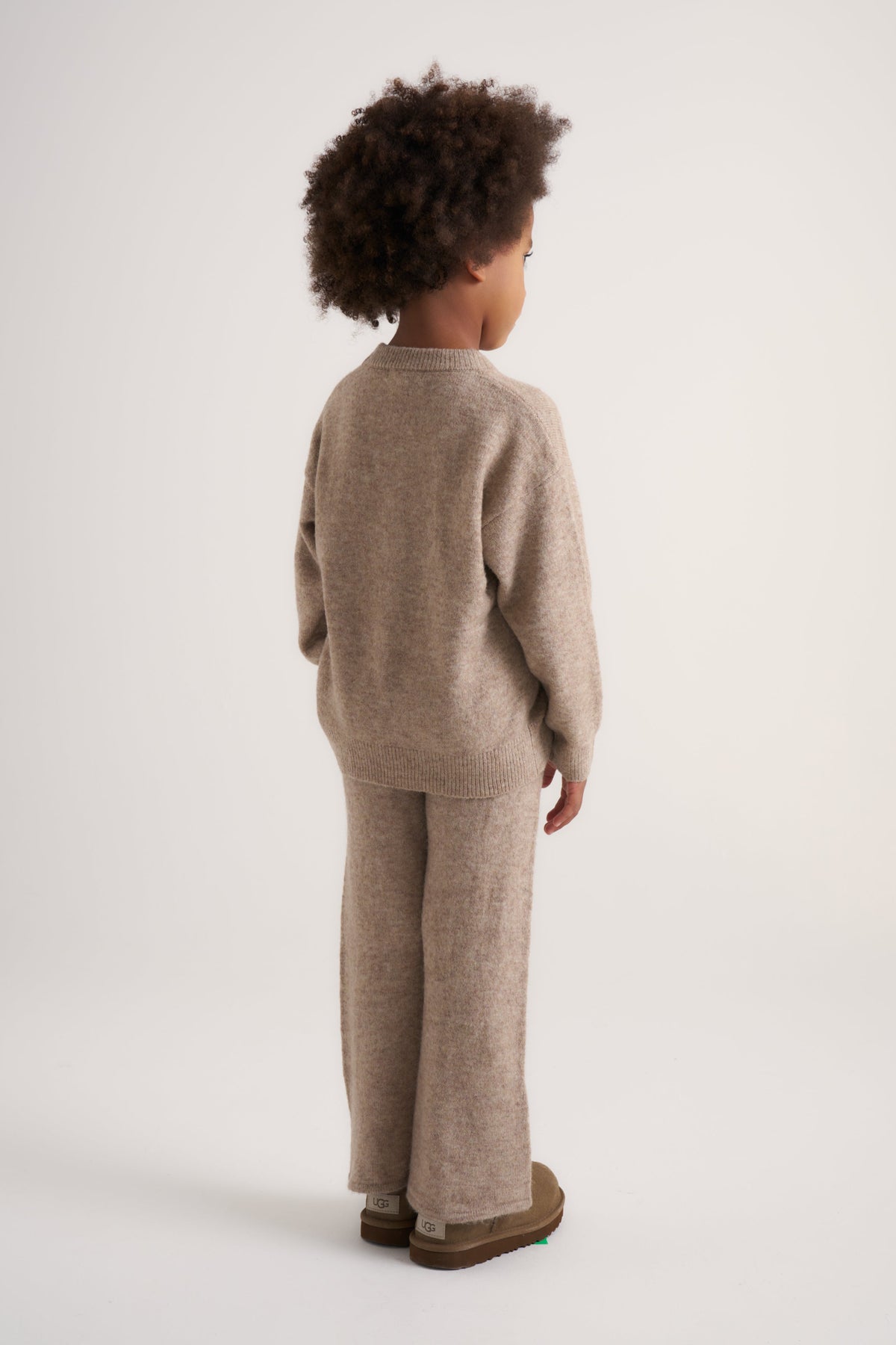 Kids Emblem Fluffy Knit Joggers in Beige – model back view