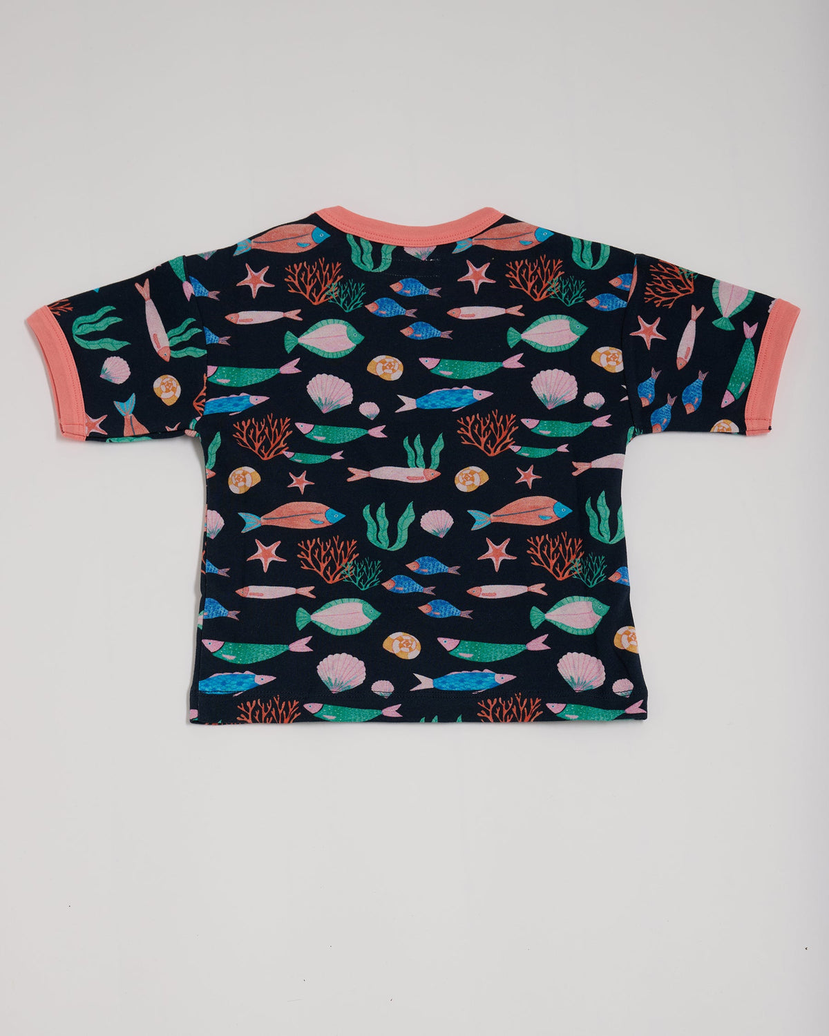 Back of short sleeved t-shirt featuring an all over vibrant navy fish print with contrast coral neck and sleeve trim.