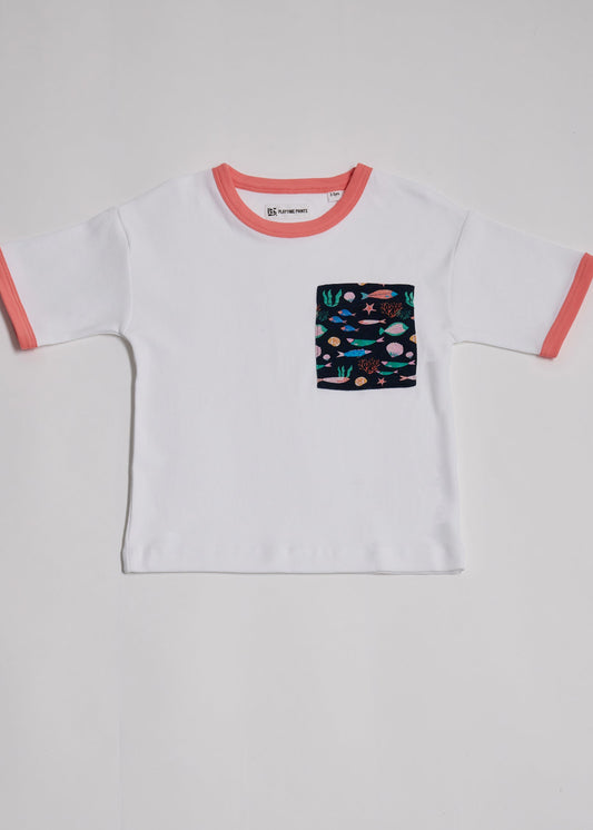 Front of white short sleeved t-shirt with vibrant fish print square chest pocket and coral neck and sleeve trim.