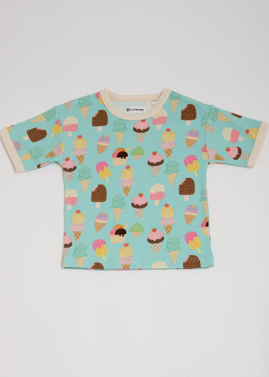 Front of short sleeved t-shirt featuring an all over turquoise ice cream print with contrast ecru neck and sleeve trim.