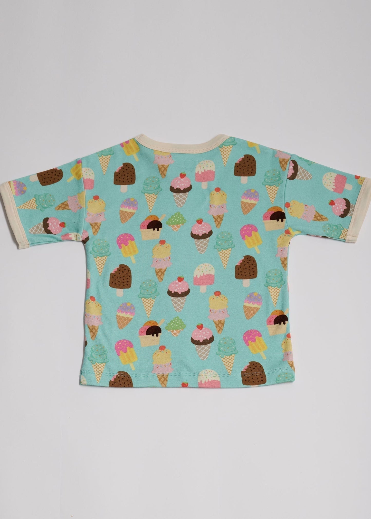 Back of short sleeved t-shirt featuring an all over turquoise ice cream print with contrast ecru neck and sleeve trim.
