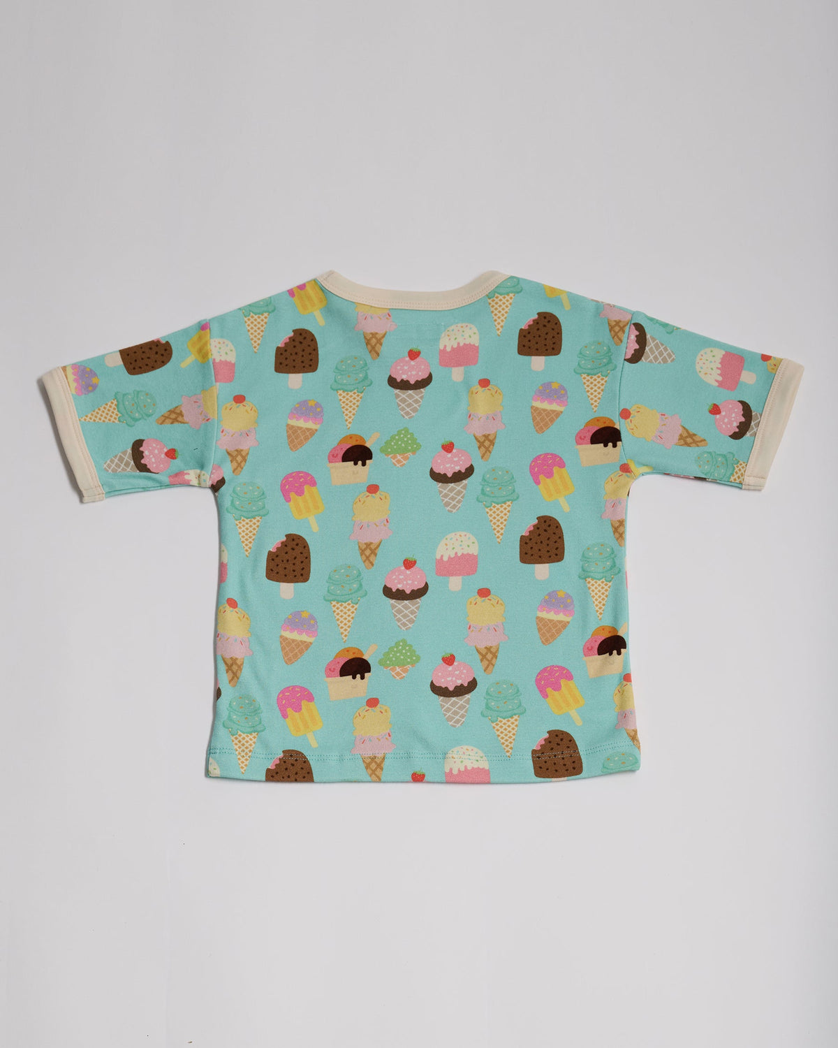 Back of short sleeved t-shirt featuring an all over turquoise ice cream print with contrast ecru neck and sleeve trim.