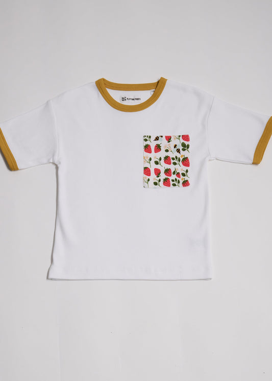 Front of white short sleeved t-shirt with fun strawberry and bees print square chest pocket and honey neck and sleeve trim.