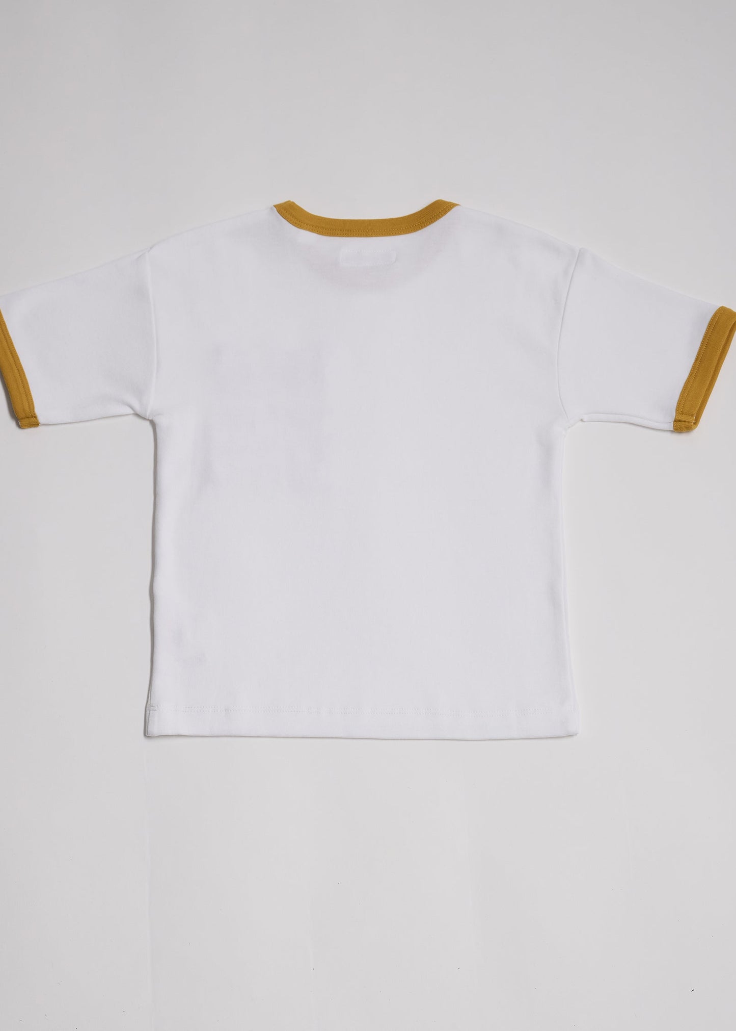 Back of white short sleeved t-shirt with honey neck and sleeve trim.